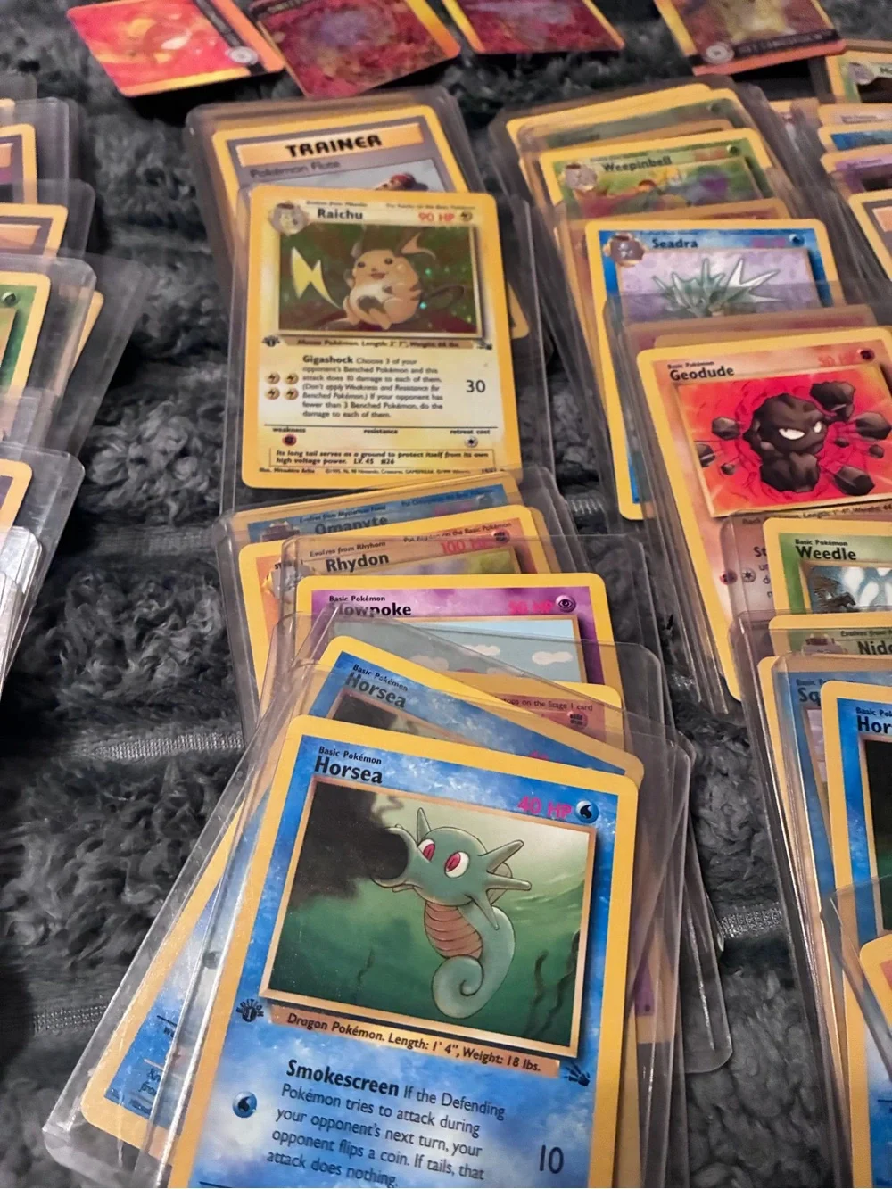 Pokemon Trading Card Lot - Assorted Colors 1997-98 trading cards in plastic hold